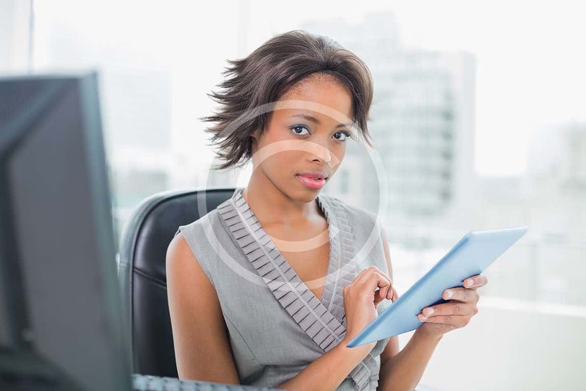 bigstock-Pretty-businesswoman-using-her-52071061.jpg